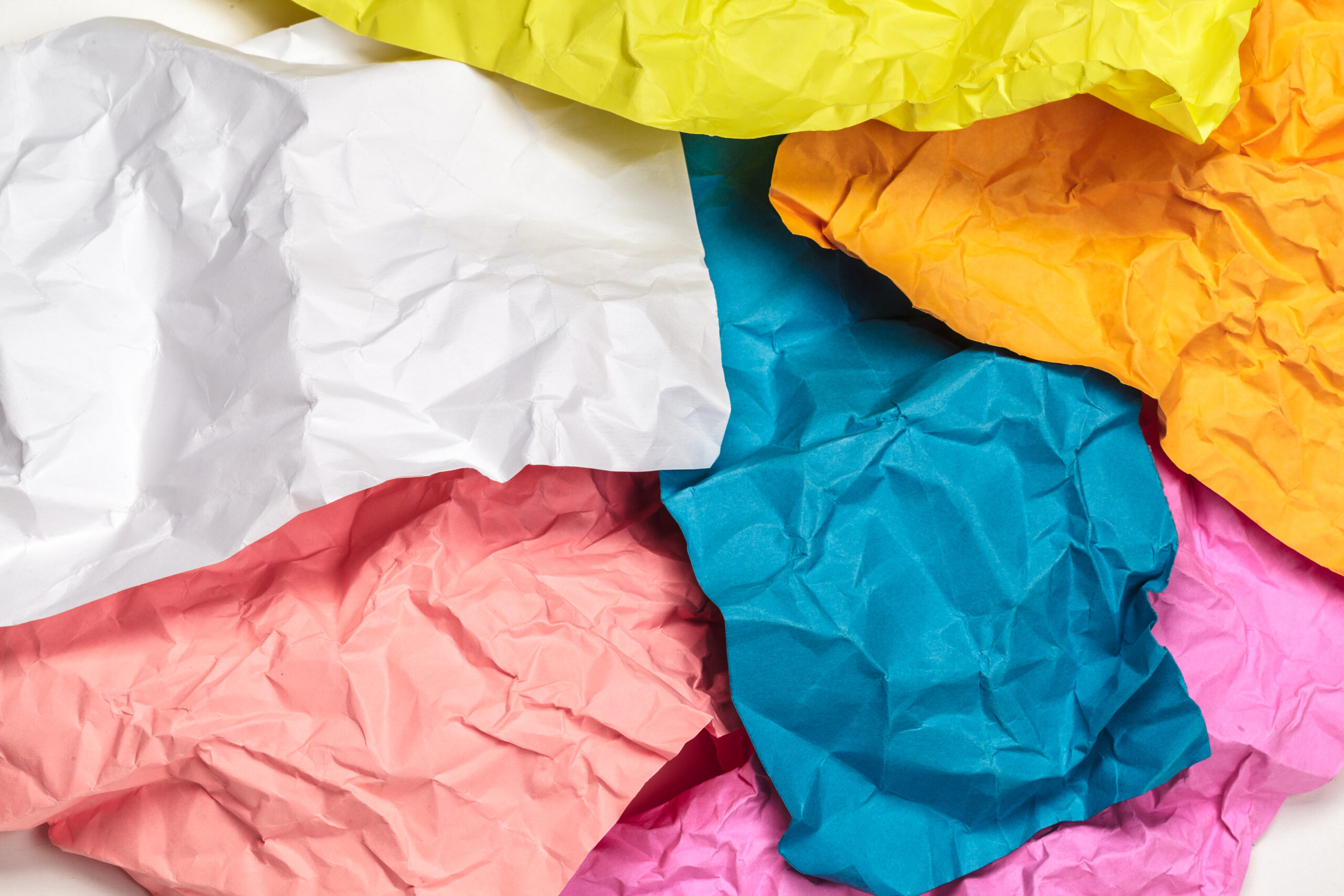 Colorful crumpled paper texture background close up.