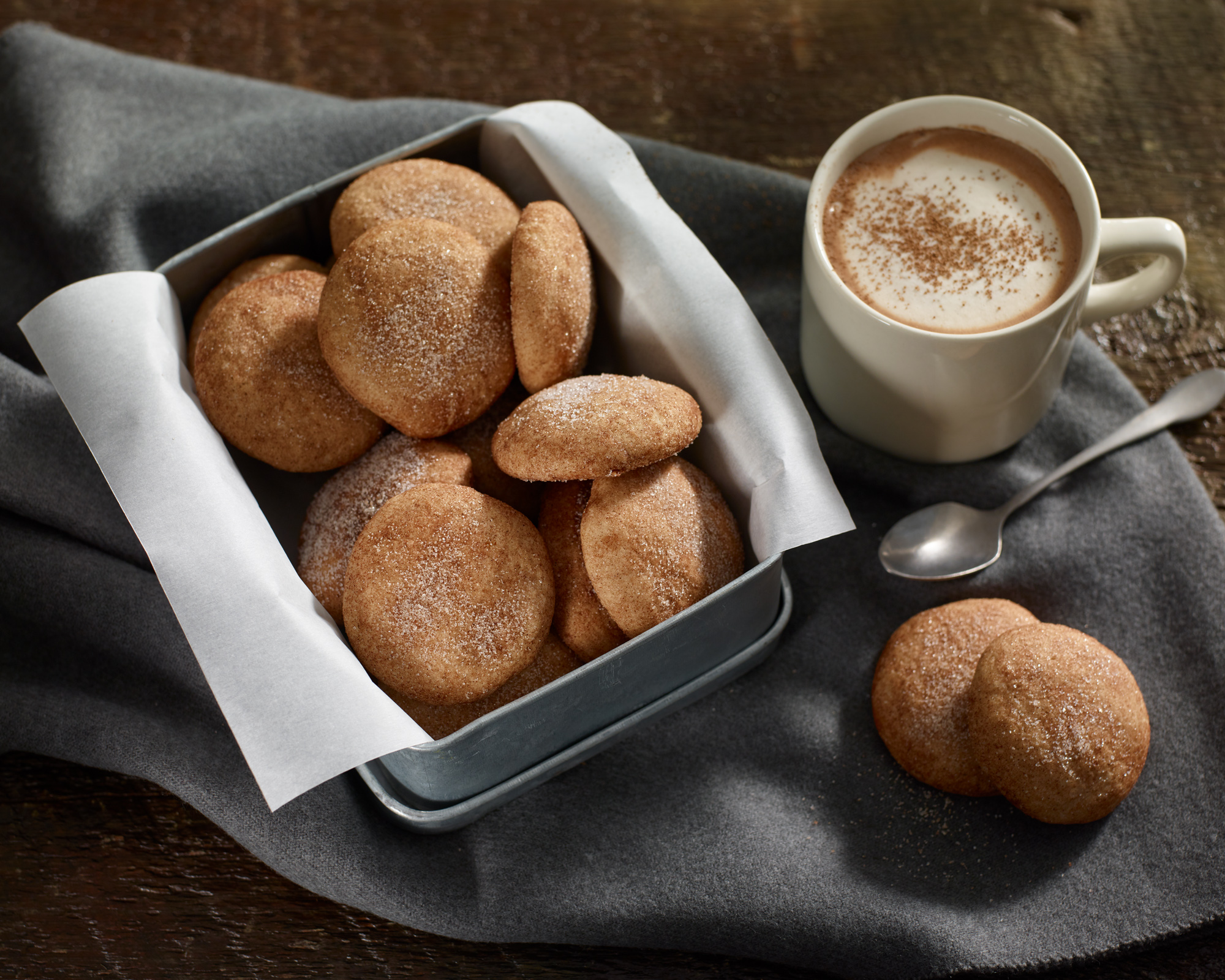 Freshly baked cookies with mug of hot chocolate.