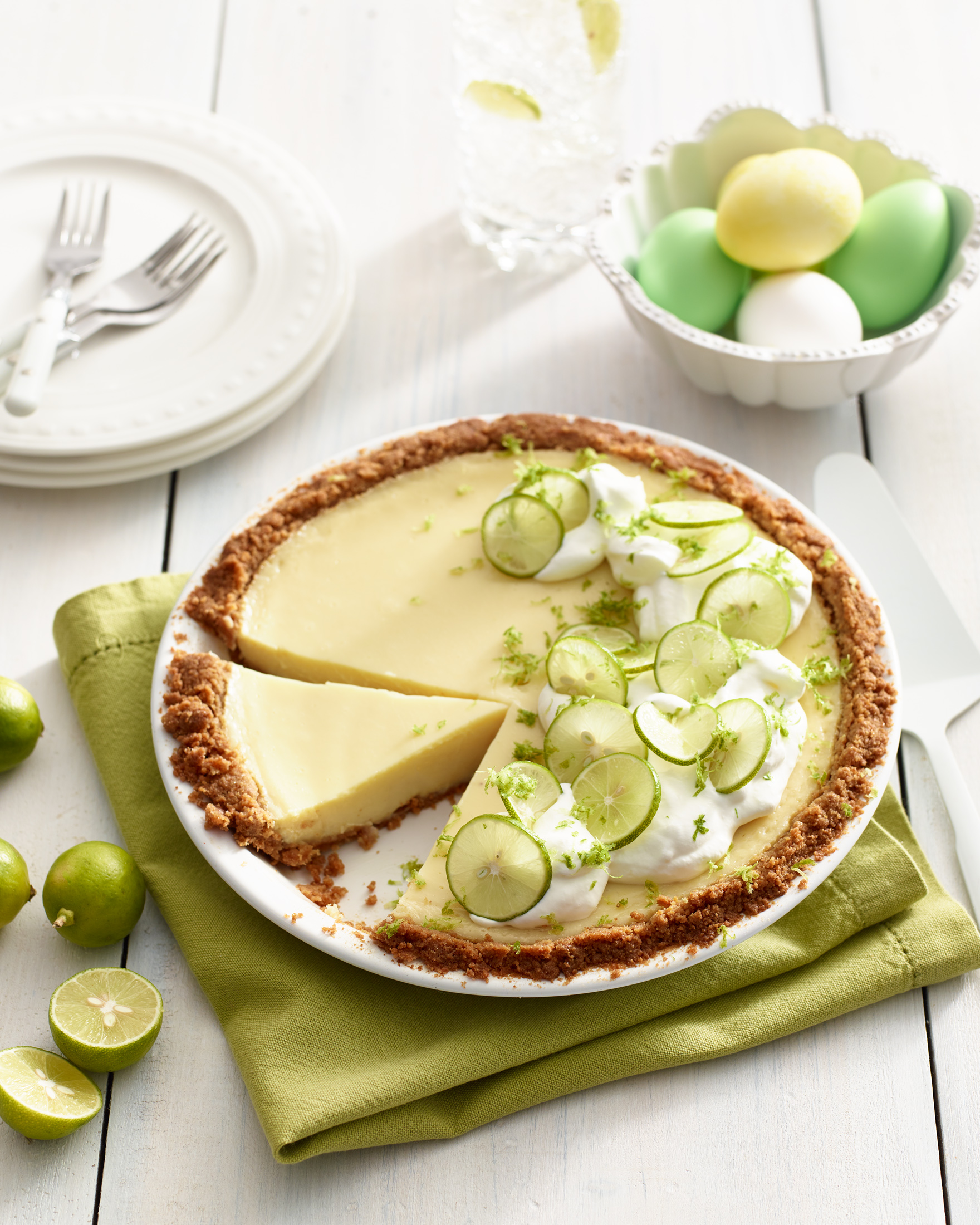Key lime pie with whipped cream and lime zest