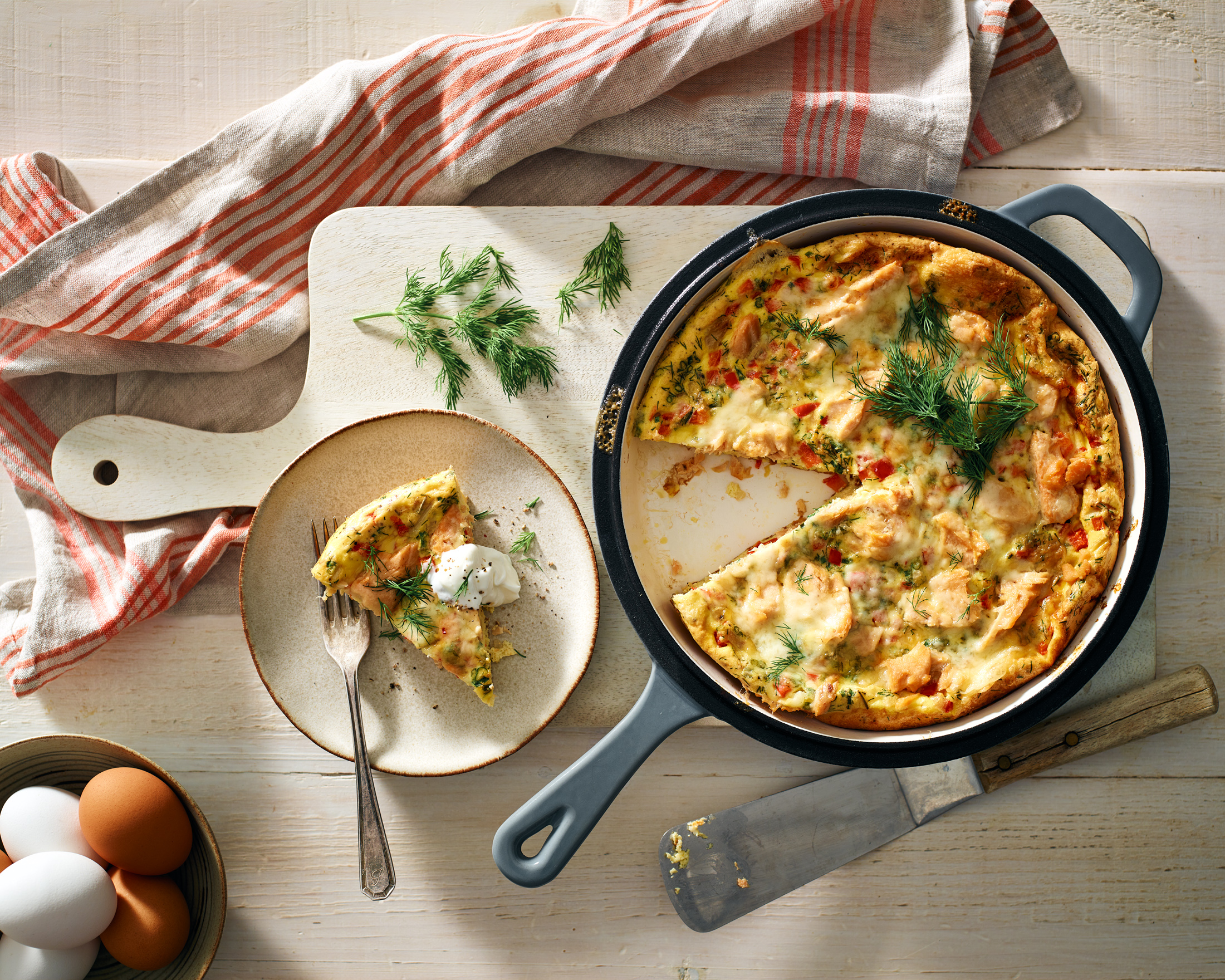 Freshly cooked frittata in skillet on table