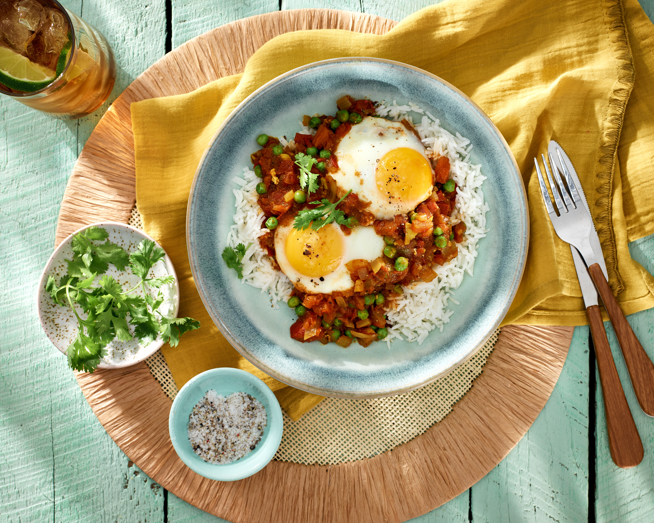Sunny side up eggs on rice with beans
