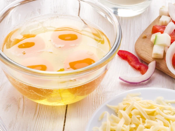 Do I add milk to eggs for an omelette?